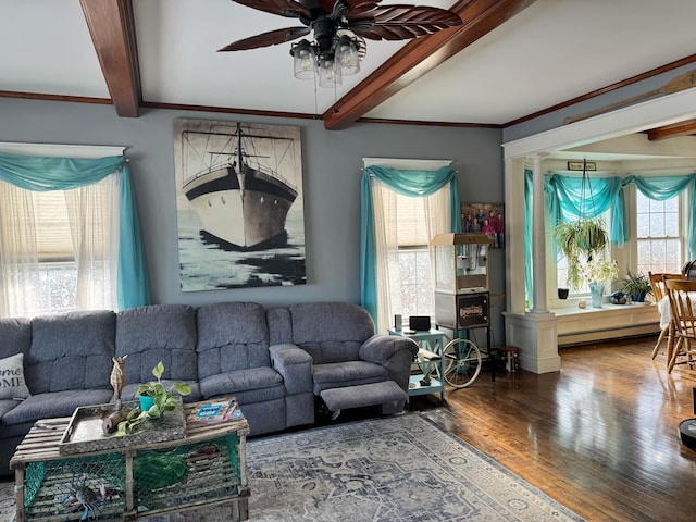 living room featuring beam ceiling, a baseboard radiator, a ceiling fan, wood finished floors, and ornate columns