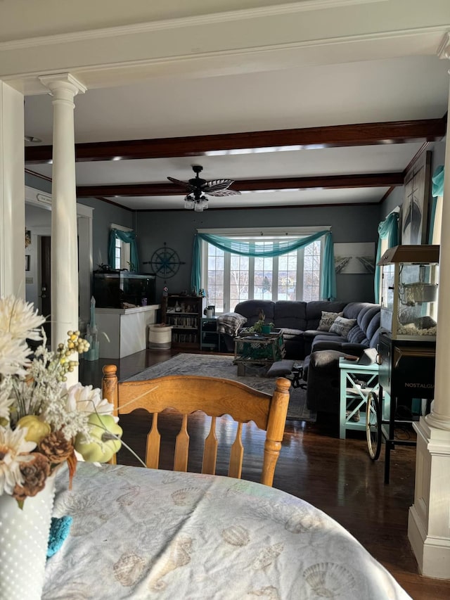 dining room with ceiling fan, beamed ceiling, ornate columns, and wood finished floors