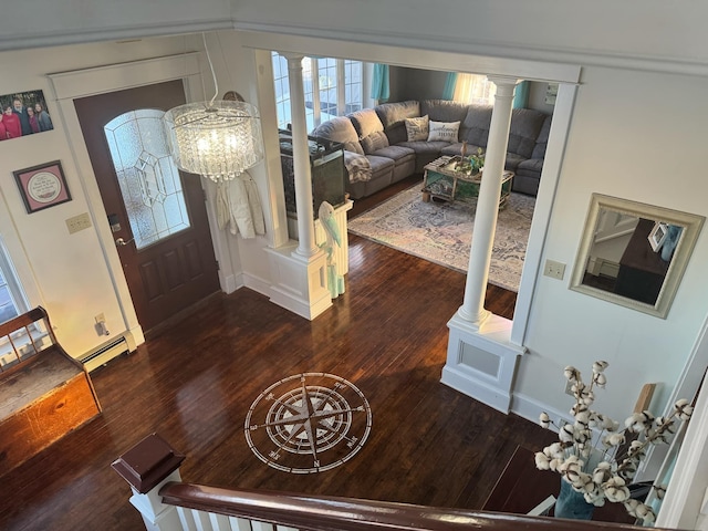 entrance foyer with dark wood-style flooring and ornate columns