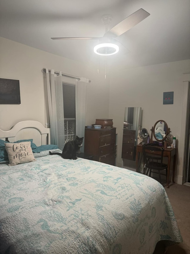 bedroom with ceiling fan and carpet flooring