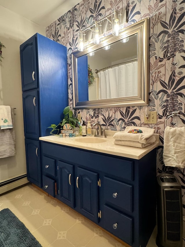 full bathroom with wallpapered walls, a baseboard heating unit, and vanity