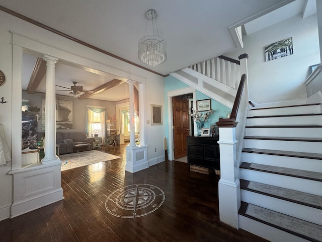 foyer entrance featuring a ceiling fan, baseboards, stairs, wood-type flooring, and ornate columns