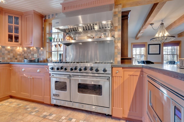 kitchen featuring backsplash, glass insert cabinets, wall chimney range hood, double oven range, and beam ceiling