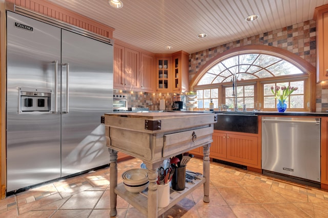 kitchen with decorative backsplash, wooden ceiling, recessed lighting, and appliances with stainless steel finishes