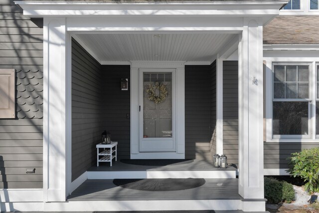 doorway to property featuring covered porch