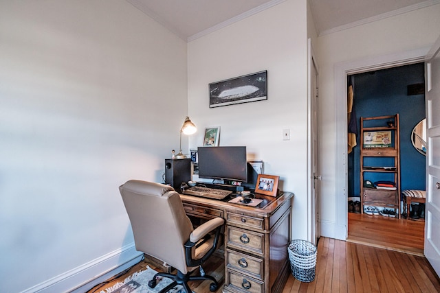 office space with hardwood / wood-style floors, crown molding, and baseboards