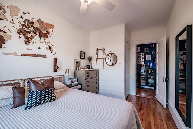 bedroom with baseboards, a ceiling fan, hardwood / wood-style floors, and crown molding