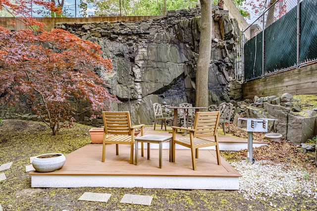 exterior space featuring a deck and outdoor dining space