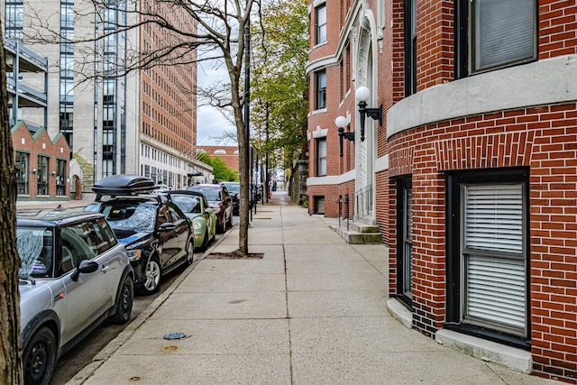 view of street featuring street lights and sidewalks