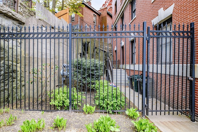 view of gate with fence