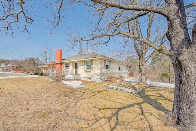 single story home featuring a front yard and a chimney