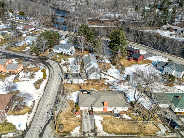 snowy aerial view featuring a residential view