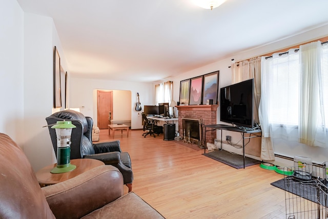 living room with a fireplace and wood finished floors