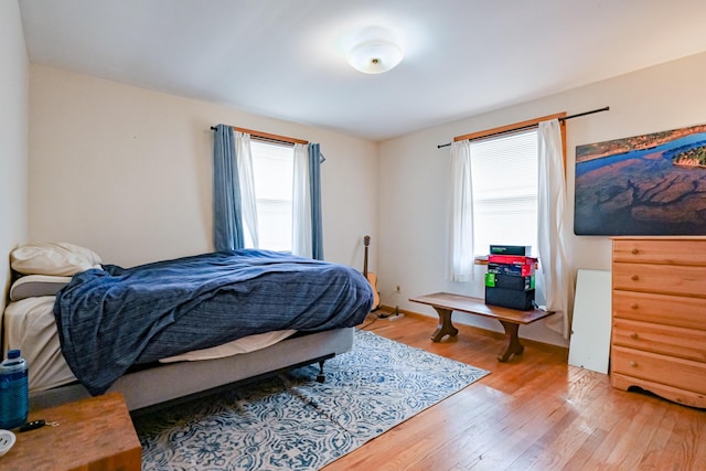 bedroom featuring light wood-style flooring