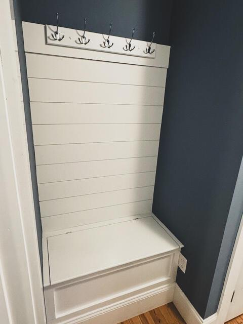 mudroom featuring light wood-type flooring and baseboards