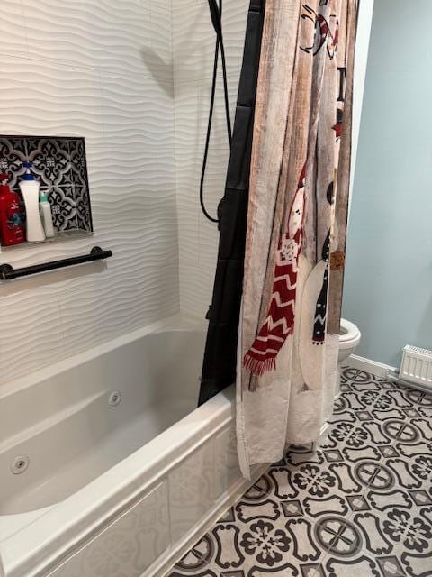 full bath featuring baseboards, toilet, shower / tub combo with curtain, and tile patterned flooring