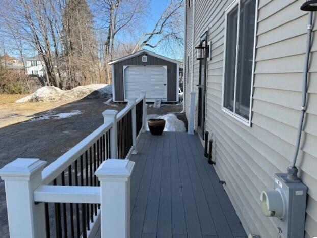 wooden deck with an outdoor structure