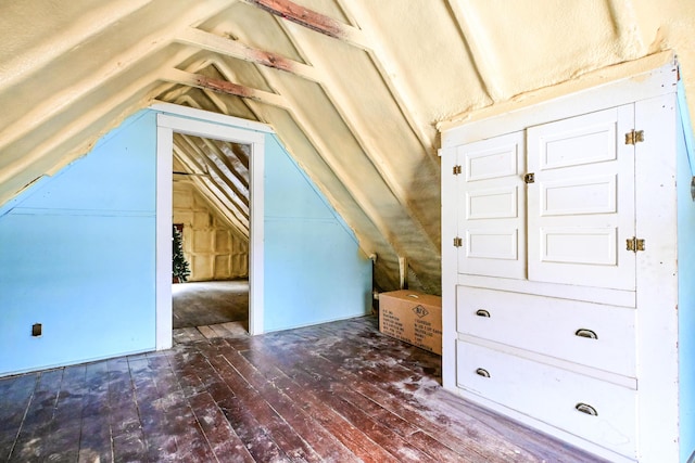 bonus room with vaulted ceiling and hardwood / wood-style flooring