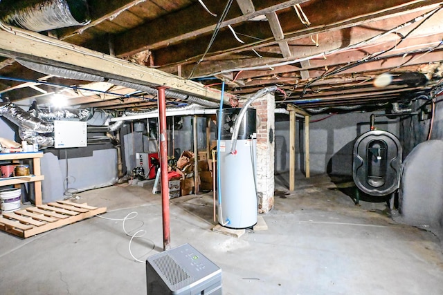 unfinished basement featuring gas water heater and heating fuel