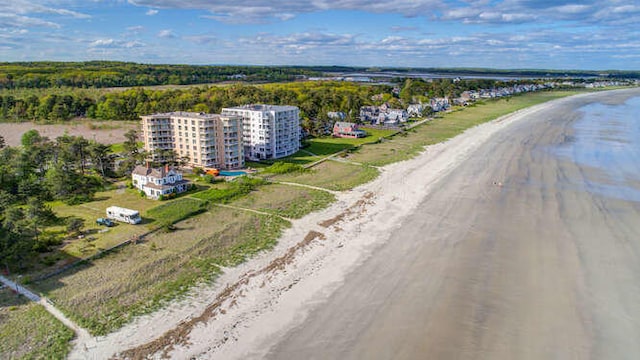 drone / aerial view featuring a view of the beach and a water view