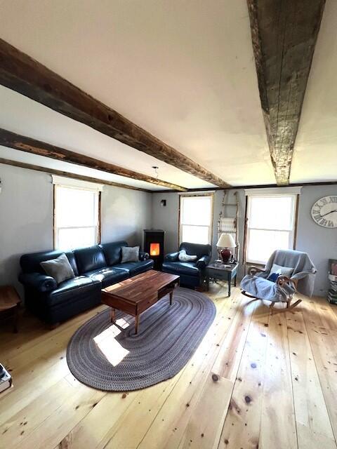 286 Lexington Rd, Kingfield, ME 04947 - living room with wood-type flooring, plenty of natural light, and beam ceiling