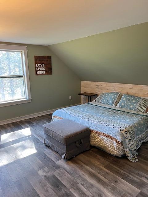 286 Lexington Rd, Kingfield, ME 04947 - bedroom with wood finished floors, lofted ceiling, and baseboards