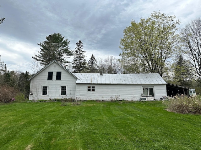 286 Lexington Rd, Kingfield, ME 04947 - view of side of home featuring a yard and metal roof