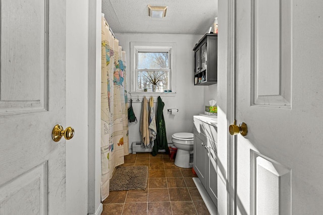 full bath with visible vents, toilet, vanity, a textured ceiling, and a baseboard radiator