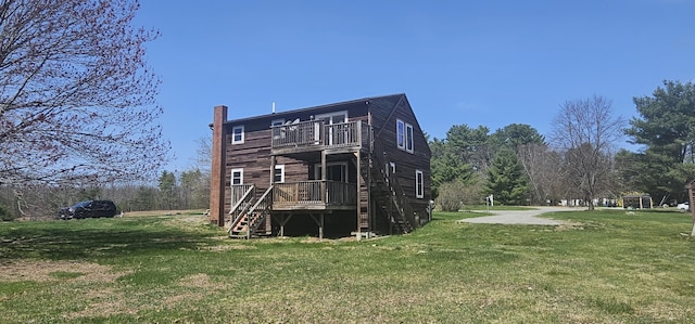 8 Cornerbrook Cir, Windham, ME 04062 - back of house featuring stairs, a wooden deck, a chimney, a balcony, and a yard