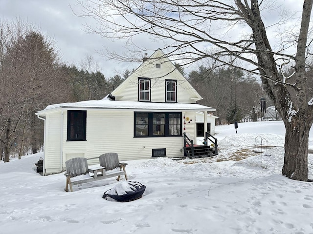 view of snow covered house