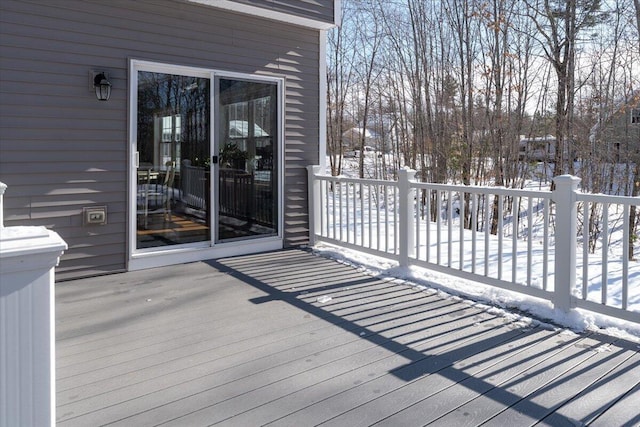 view of snow covered deck