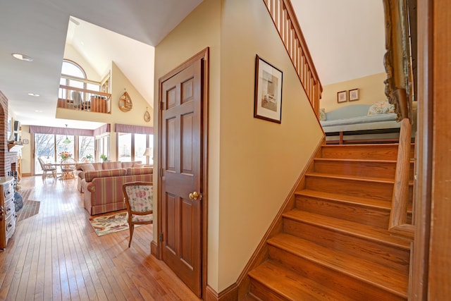 189 Mills Rd, Kennebunkport, ME 04046 - staircase featuring vaulted ceiling and wood-type flooring