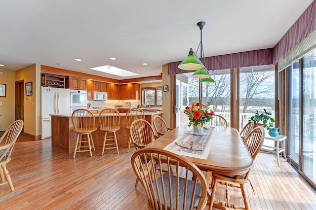 189 Mills Rd, Kennebunkport, ME 04046 - dining space with recessed lighting, a skylight, a wealth of natural light, and light wood finished floors