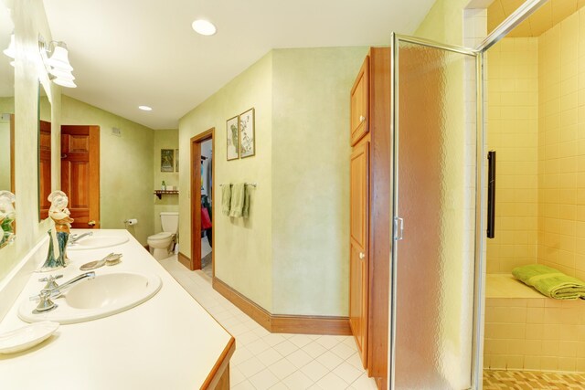 189 Mills Rd, Kennebunkport, ME 04046 - bathroom with a shower stall, tile patterned flooring, double vanity, and a sink