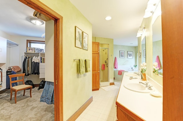 189 Mills Rd, Kennebunkport, ME 04046 - full bathroom with a stall shower, a walk in closet, and vanity