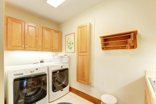 189 Mills Rd, Kennebunkport, ME 04046 - clothes washing area featuring light tile patterned flooring, washer and clothes dryer, cabinet space, and baseboards