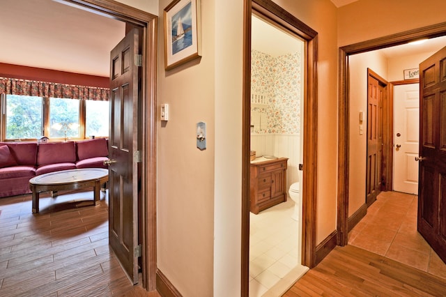 189 Mills Rd, Kennebunkport, ME 04046 - hall with wood finished floors and a wainscoted wall