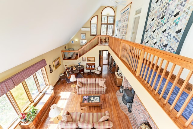 189 Mills Rd, Kennebunkport, ME 04046 - living room with high vaulted ceiling, wood finished floors, ceiling fan, and stairs