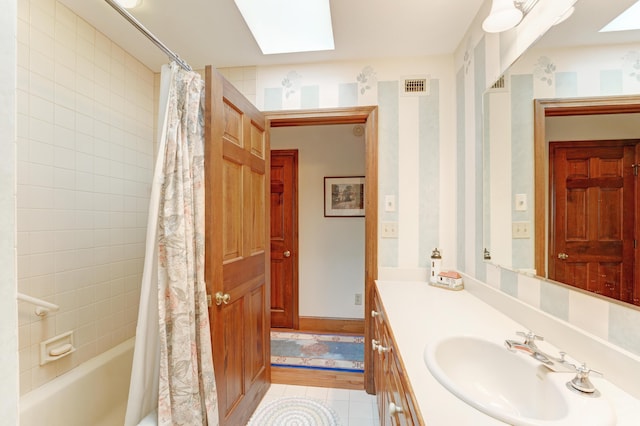 189 Mills Rd, Kennebunkport, ME 04046 - full bath featuring a skylight, tile patterned floors, shower / bath combination with curtain, vanity, and visible vents