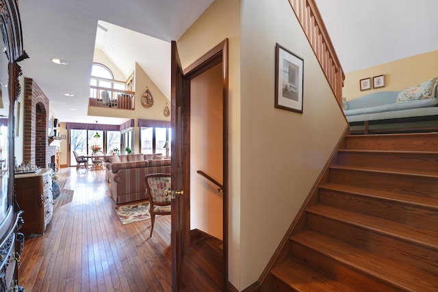 189 Mills Rd, Kennebunkport, ME 04046 - staircase featuring recessed lighting, wood-type flooring, and vaulted ceiling
