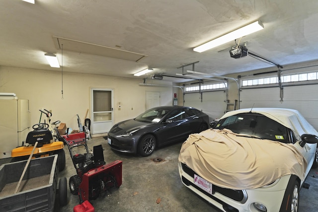 189 Mills Rd, Kennebunkport, ME 04046 - garage with a garage door opener and freestanding refrigerator