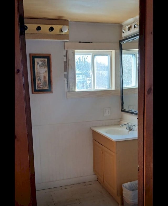 bathroom featuring a healthy amount of sunlight and vanity