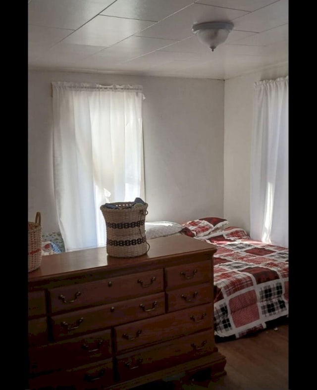 bedroom featuring wood finished floors