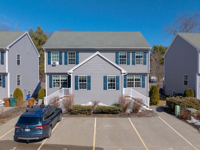 colonial house with uncovered parking