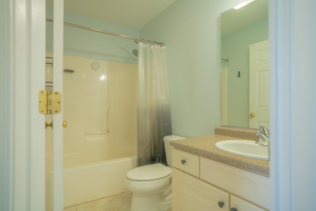 full bath with tile patterned floors, vanity, toilet, and shower / tub combo with curtain