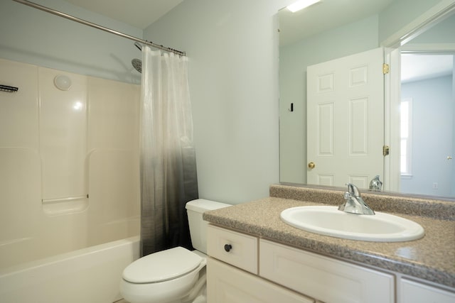 bathroom with vanity, toilet, and shower / bath combo