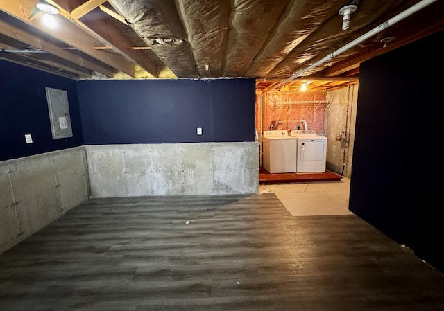 unfinished below grade area with separate washer and dryer and wood finished floors