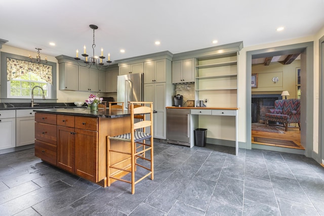 598 Walnut Hill Rd, North Yarmouth, ME 04097 - kitchen featuring high quality fridge, a chandelier, a breakfast bar, a fireplace, and recessed lighting