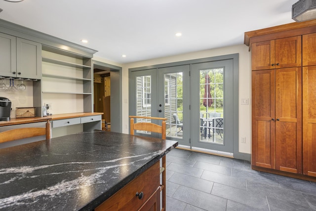 598 Walnut Hill Rd, North Yarmouth, ME 04097 - kitchen featuring french doors, recessed lighting, open shelves, dark stone counters, and dark tile patterned flooring