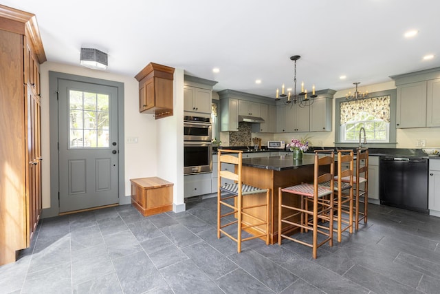 598 Walnut Hill Rd, North Yarmouth, ME 04097 - kitchen with dishwasher, double oven, a chandelier, under cabinet range hood, and a breakfast bar